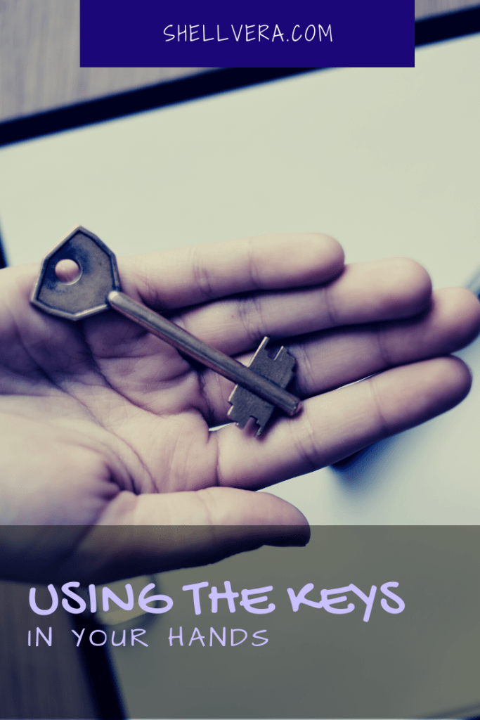 Picture of a person holding a key.