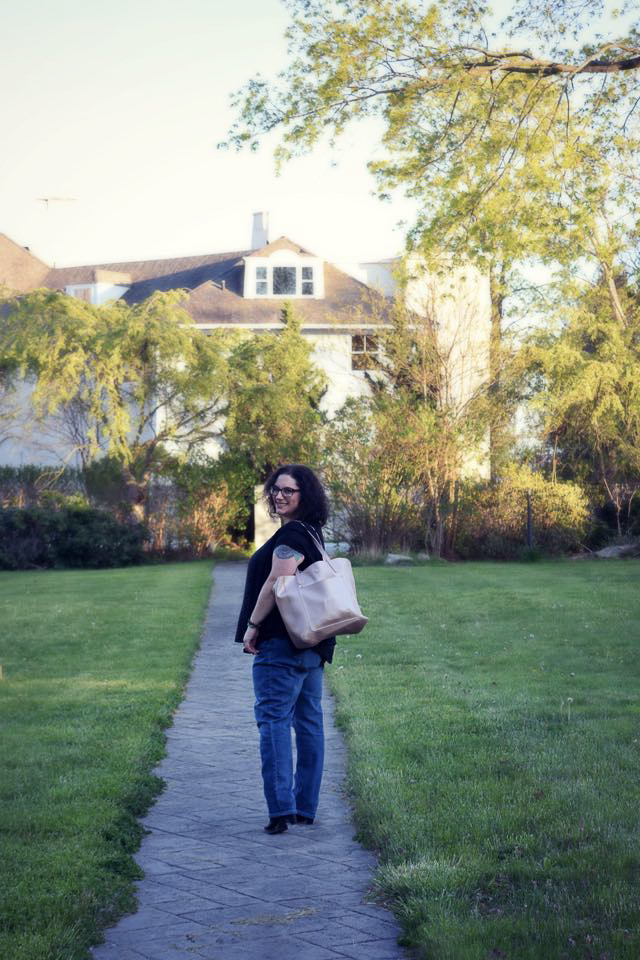 A picture of me looking back as I walk away smiling.